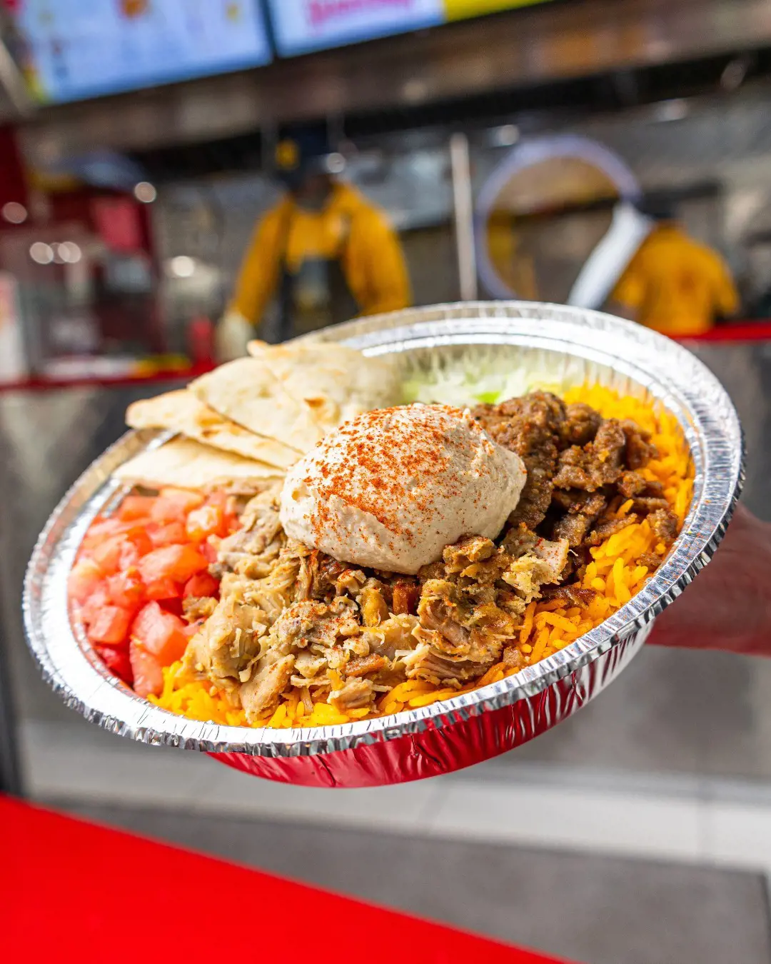 A scoop of yummy hummus on The Halal Guys platter.