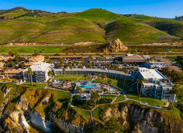 A bird's eye view of theSeaCrest OceanFront Hotel with a beautiful countryside background