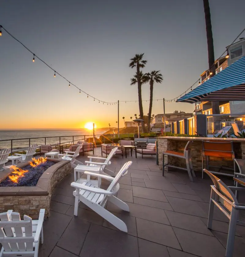 A bird's eye view of theSeaCrest OceanFront Hotel with a beautiful countryside background