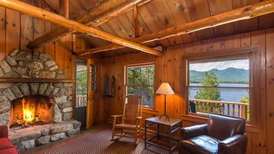 Wooden-paneled room for fireplace at Elk Lake Lodge