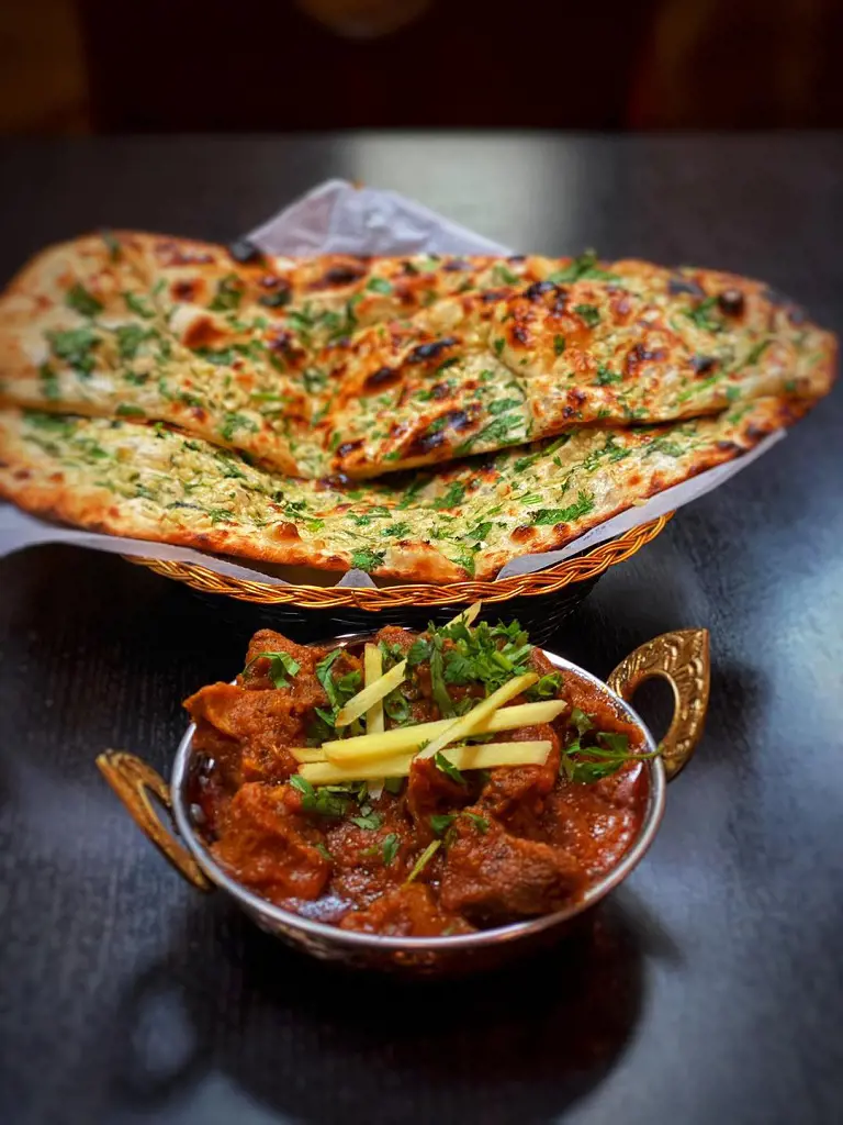 Tasty butter naan served with mutton curry at Zaika