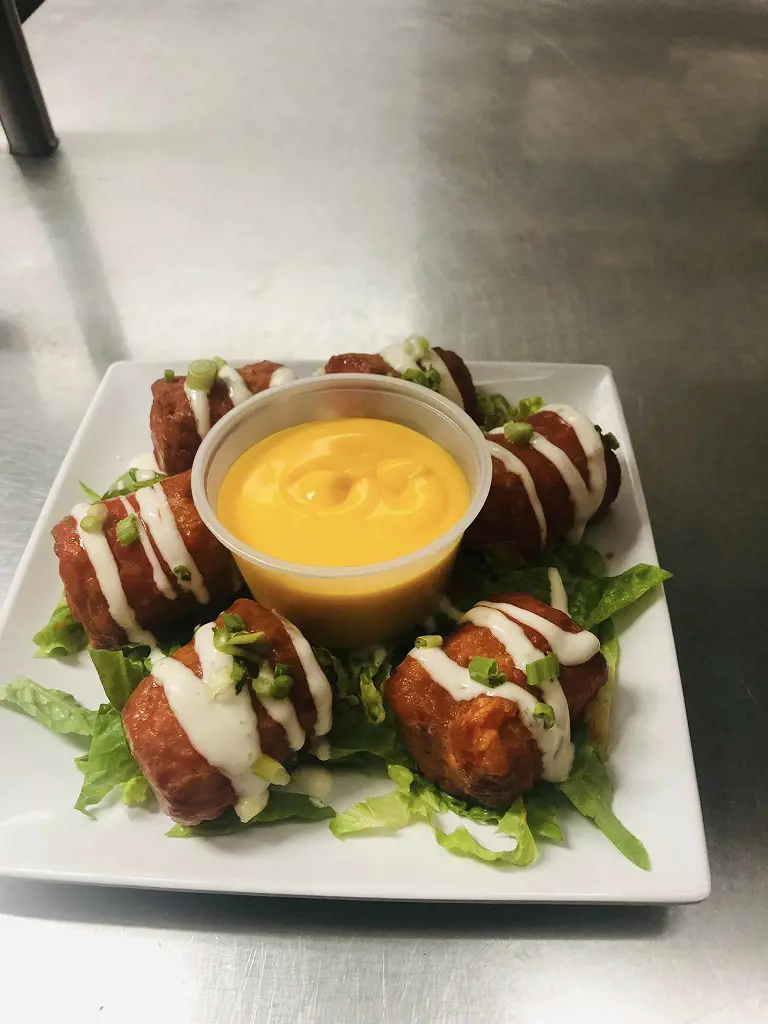 Appetizing plate of sausage with homemade mustard sauce at The Olde Log Inn 