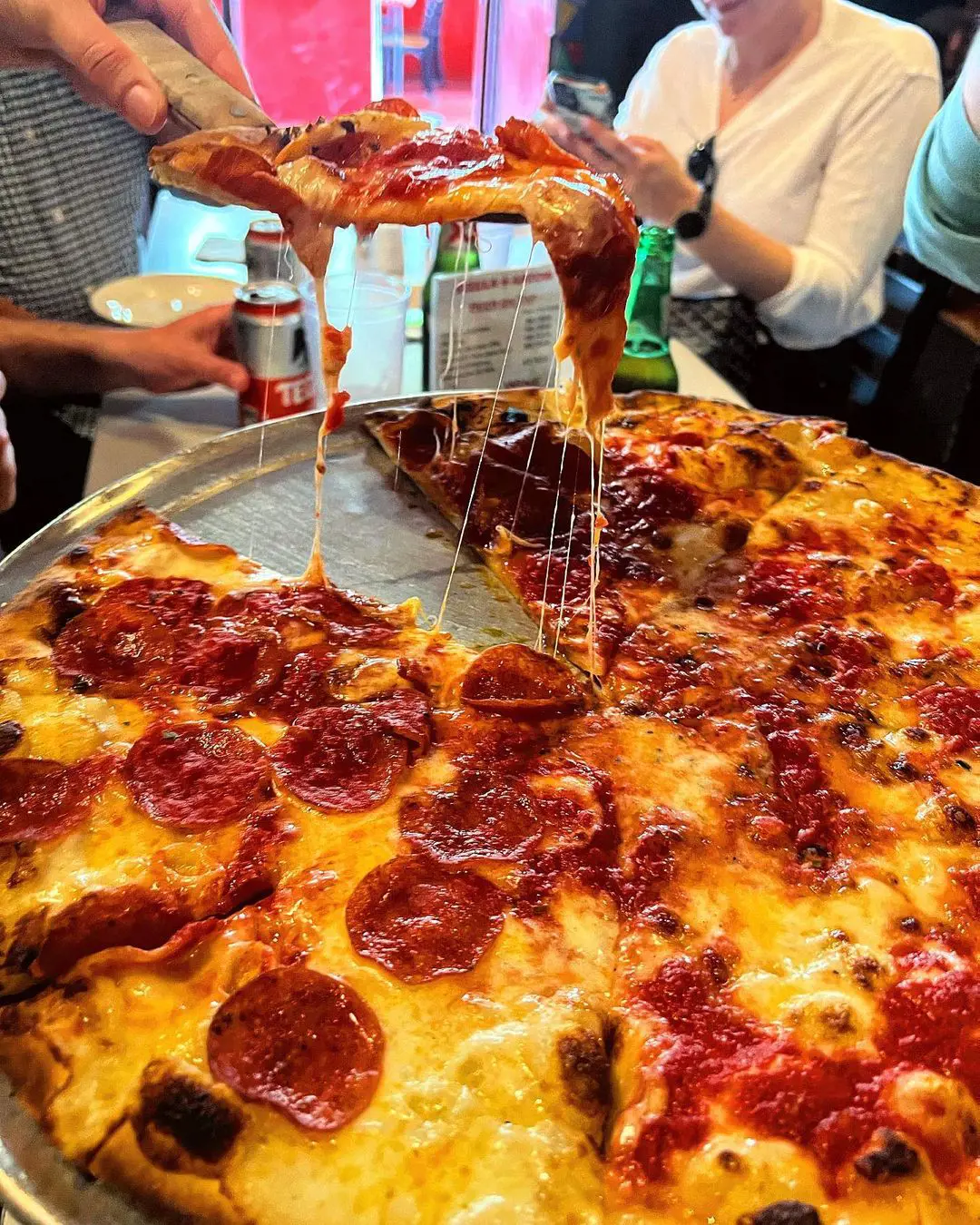 Cheese pull at John's of Bleecker Street.